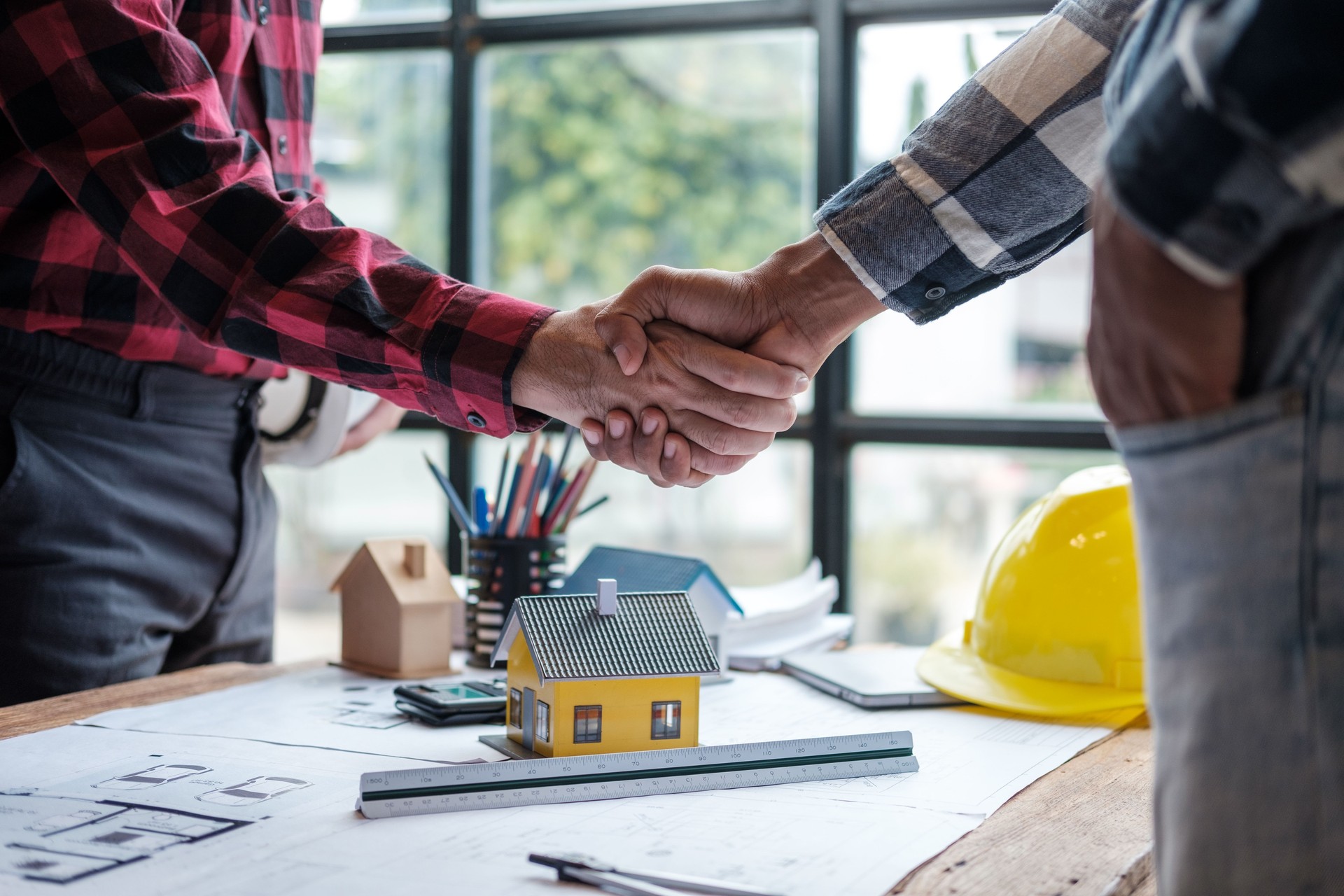 Foreman or Civil engineer handshake making modern construction. industry professional team and engineer concept
